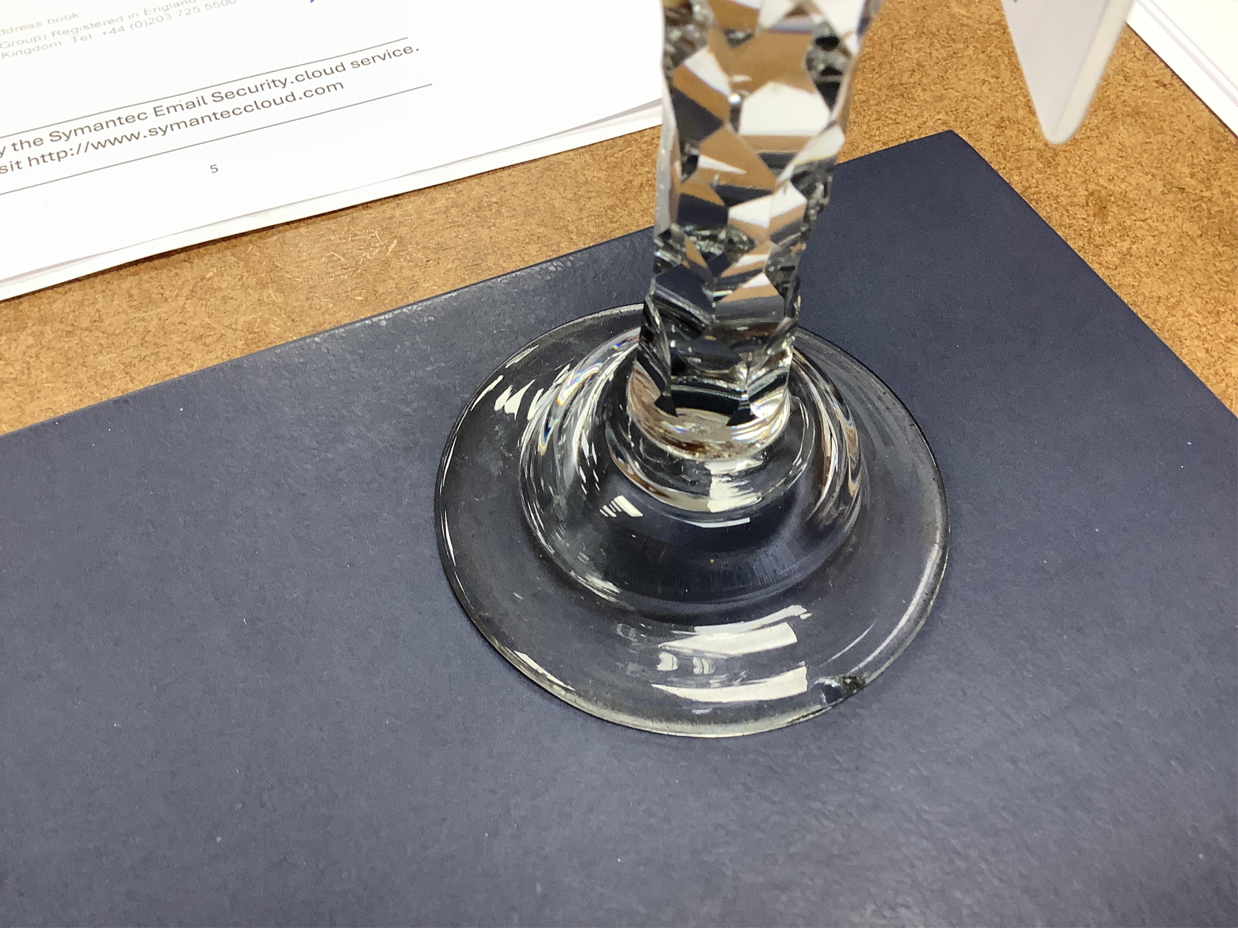 An opaque twist firing glass with terraced foot and a faceted wine glass with domed foot, c.1760, tallest 14cm